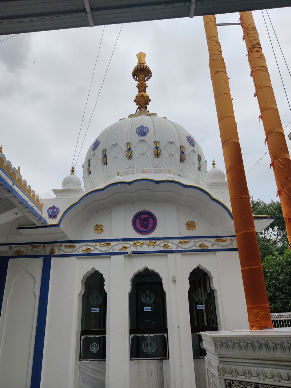 Evening lamps lit around the Gurdwara complex